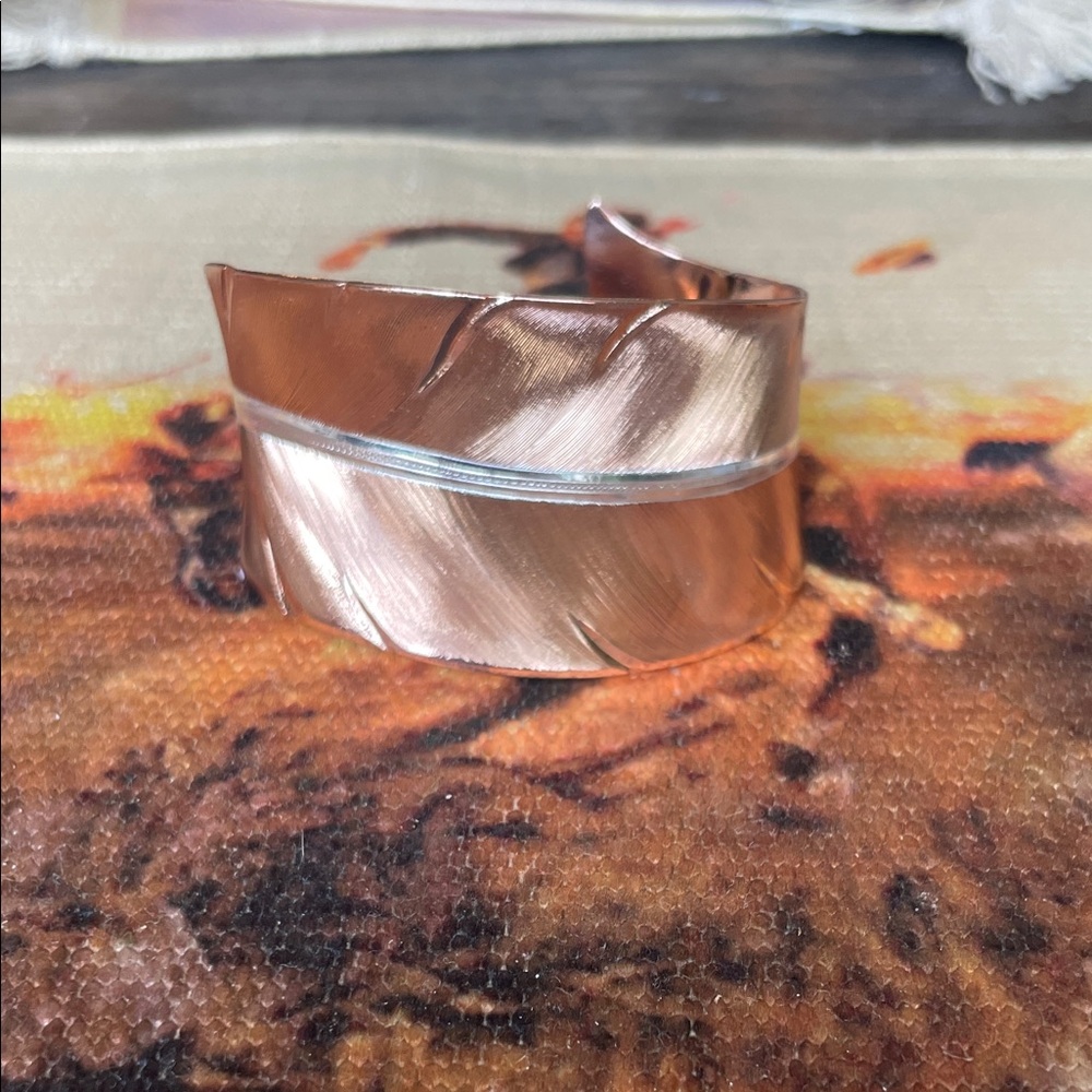 Montana silver copper and silver feather cuff.
